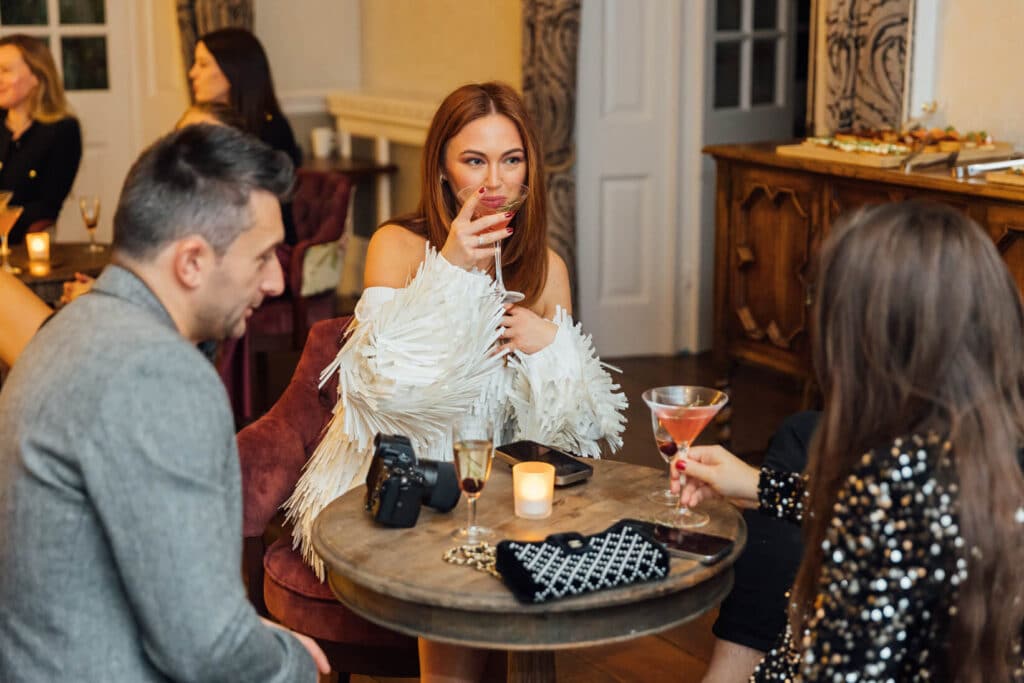 People enjoying cocktails at a launch event