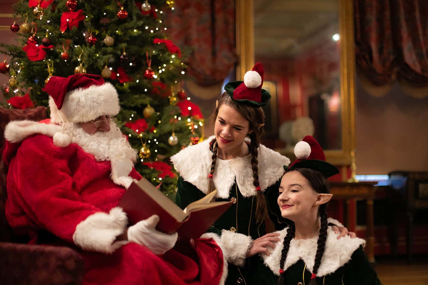 Santa checking list with elves at Warwick Castle
